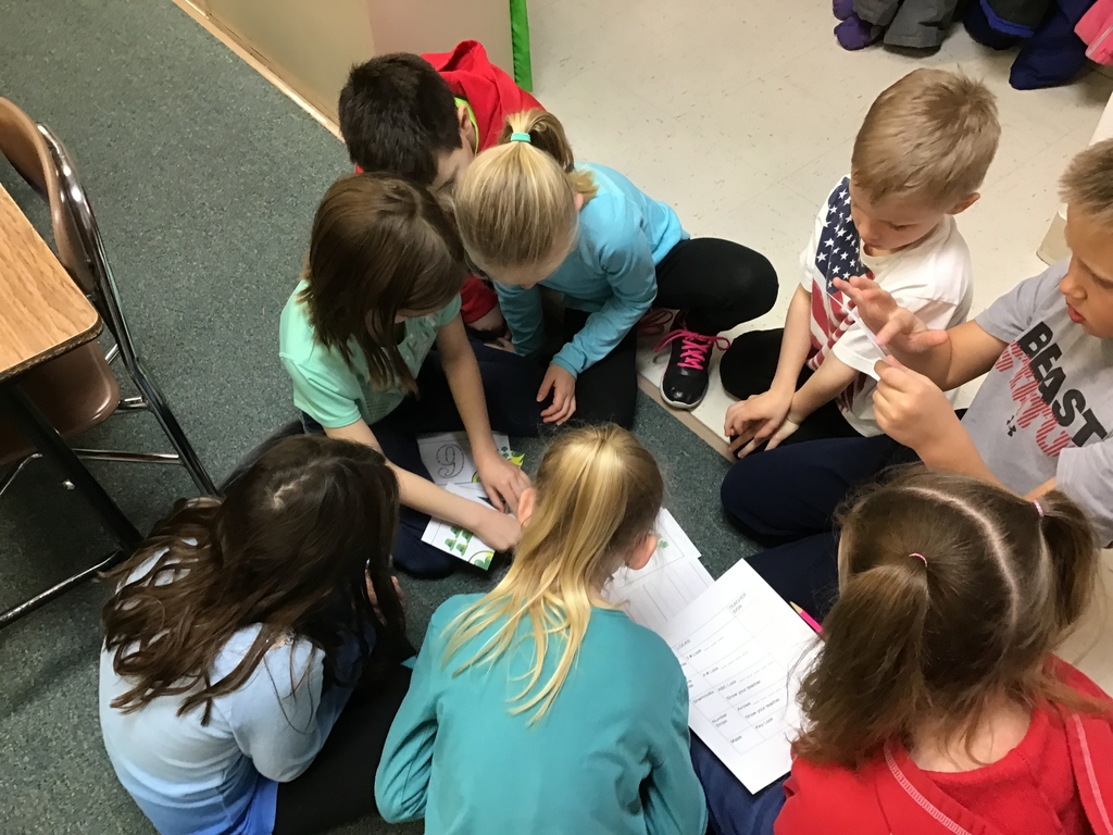 Students in a circle solving a clue.